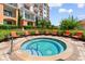 Outdoor hot tub surrounded by lush landscaping and seating at 8121 Amalfi Pl. # 4-1006, Myrtle Beach, SC 29572