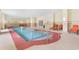 Indoor pool area with lounge chairs at 8121 Amalfi Pl. # 4-1006, Myrtle Beach, SC 29572