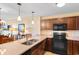 Open-concept kitchen with stainless steel appliances and views into the dining and living areas at 8121 Amalfi Pl. # 4-1006, Myrtle Beach, SC 29572