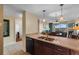 Open kitchen with stainless steel appliances, granite countertops, and a view into the adjacent living area at 8121 Amalfi Pl. # 4-1006, Myrtle Beach, SC 29572