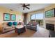 Inviting living room featuring a fireplace, comfortable seating, and a balcony with views at 8121 Amalfi Pl. # 4-1006, Myrtle Beach, SC 29572