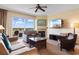 Comfortable living room with plush seating, fireplace, television, and a balcony with scenic views at 8121 Amalfi Pl. # 4-1006, Myrtle Beach, SC 29572