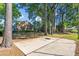 Outdoor basketball court surrounded by mature trees, offering recreational opportunities for residents at 830 44Th Ave. N # T3, Myrtle Beach, SC 29577