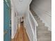 Inviting foyer with hardwood floors, staircase, and an open view to the living area at 830 44Th Ave. N # T3, Myrtle Beach, SC 29577