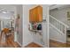 Hallway featuring built-in shelving with convenient storage and accessibility to the staircase and dining room at 830 44Th Ave. N # T3, Myrtle Beach, SC 29577