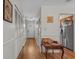 Hallway with hardwood floors, storage, and white wainscoting at 830 44Th Ave. N # T3, Myrtle Beach, SC 29577