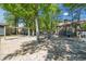 Community playground with swings and climbing structures, nestled among mature trees at 830 44Th Ave. N # T3, Myrtle Beach, SC 29577
