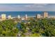 Panoramic aerial view highlighting beachfront condos, a serene lake, and lush greenery in a coastal setting at 8500 Margate Circle # 505, Myrtle Beach, SC 29572