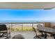 Outdoor seating area boasts incredible oceanfront views from private balcony at 8500 Margate Circle # 505, Myrtle Beach, SC 29572