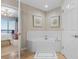 Luxurious bathroom features a soaking tub, marble floors, and elegant fixtures at 8500 Margate Circle # 505, Myrtle Beach, SC 29572