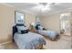 Charming bedroom with two twin beds, nautical decor, and a ceiling fan at 8500 Margate Circle # 505, Myrtle Beach, SC 29572