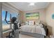 Cozy bedroom with daybed, beach view, and home exercise equipment at 8500 Margate Circle # 505, Myrtle Beach, SC 29572