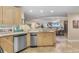 Spacious open kitchen showcases stainless steel appliances, breakfast bar seating and views of the living and dining area at 8500 Margate Circle # 505, Myrtle Beach, SC 29572
