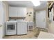 Functional laundry room with modern appliances and storage cabinets at 8500 Margate Circle # 505, Myrtle Beach, SC 29572