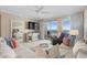 Inviting living room featuring a large sectional couch and ocean view balcony at 8500 Margate Circle # 505, Myrtle Beach, SC 29572