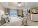 Bright main bedroom with tray ceiling, beach view, and sitting area at 8500 Margate Circle # 505, Myrtle Beach, SC 29572