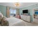 Inviting main bedroom with king bed, coastal decor, dresser, and private balcony access with ocean views at 8500 Margate Circle # 505, Myrtle Beach, SC 29572