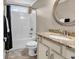 Bathroom features a shower-tub combo, granite countertop vanity, and neutral finishes at 904 Moultrie Circle, Myrtle Beach, SC 29588