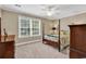 Comfortable bedroom featuring natural light, a ceiling fan, and carpet flooring at 904 Moultrie Circle, Myrtle Beach, SC 29588