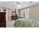 Cozy bedroom with a four-poster bed, ceiling fan, and sunny window at 904 Moultrie Circle, Myrtle Beach, SC 29588