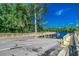 Boat ramp providing access to the waterway surrounded by trees and vegetation beneath a bright blue sky at 904 Moultrie Circle, Myrtle Beach, SC 29588