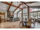 Stunning clubhouse interior featuring exposed wood beams, stone fireplace, and elegant dining and seating areas at 904 Moultrie Circle, Myrtle Beach, SC 29588