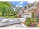 Exterior of a two-story home with a brick and siding facade, attached garage, and a spacious driveway and green yard at 904 Moultrie Circle, Myrtle Beach, SC 29588