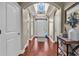 Grand foyer with hardwood floors, arched doorways, and decorative glass accents, showcasing elegance at 904 Moultrie Circle, Myrtle Beach, SC 29588