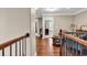 Upstairs hallway with hardwood floors leads to cozy living spaces at 904 Moultrie Circle, Myrtle Beach, SC 29588