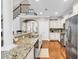 Modern kitchen with granite countertops, stainless steel appliances, and ample cabinet space at 904 Moultrie Circle, Myrtle Beach, SC 29588