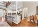 Open concept kitchen with granite countertops, stainless steel appliances, and breakfast bar at 904 Moultrie Circle, Myrtle Beach, SC 29588