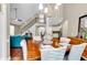Open-concept living room with high ceilings, hardwood floors, and a staircase leading to the second floor at 904 Moultrie Circle, Myrtle Beach, SC 29588