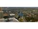 Breathtaking aerial view of a neighborhood featuring lush landscaping, lake, and condo buildings at 9994 Beach Club Dr. # 2402, Myrtle Beach, SC 29572