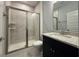 Modern bathroom with glass-enclosed shower, vanity, and contemporary fixtures at 1005 Lady Bird Way, North Myrtle Beach, SC 29582