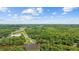 Aerial view of the home and its waterfront location surrounded by lush greenery at 1022 Waccamaw Dr., Conway, SC 29526