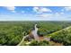 Wide aerial shot capturing the house's position along the winding river and surrounding landscape at 1022 Waccamaw Dr., Conway, SC 29526
