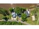 Aerial view of waterfront homes with docks, trees, and road at 1022 Waccamaw Dr., Conway, SC 29526