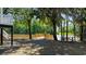 Beautiful backyard view with a wooden dock, picnic table, and river access at 1022 Waccamaw Dr., Conway, SC 29526