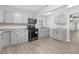 A well-lit kitchen with gray cabinets and stainless steel appliances at 1022 Waccamaw Dr., Conway, SC 29526