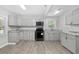 Well lit kitchen featuring gray cabinets and stainless appliances at 1022 Waccamaw Dr., Conway, SC 29526