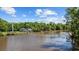 Expansive view of the riverfront homes with docks, lush trees and blue skies at 1022 Waccamaw Dr., Conway, SC 29526