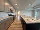 Modern kitchen with a large center island, granite countertops, and stainless steel appliances at 1117 Oxeye St., North Myrtle Beach, SC 29582