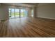 Spacious living room with a wall of sliding glass doors leading to an outdoor living area at 1117 Oxeye St., North Myrtle Beach, SC 29582