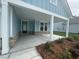 Covered porch area featuring brick detail at the base and square white support beams at 1117 Oxeye St., North Myrtle Beach, SC 29582