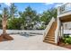 The backyard features a private pool, fenced yard, back porch staircase, and a concrete patio at 135A Sunset Dr., Murrells Inlet, SC 29576