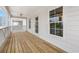 A spacious balcony with wooden floors offers an inviting outdoor space and scenic views at 135A Sunset Dr., Murrells Inlet, SC 29576