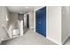 Bright hallway featuring neutral walls, carpets, white trim, and a blue closet at 135A Sunset Dr., Murrells Inlet, SC 29576