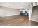 Open floor plan featuring stairs, kitchen, and living area, hardwood floors, and lots of natural light at 135A Sunset Dr., Murrells Inlet, SC 29576