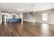 Open floor plan featuring stairs, kitchen, and living area, hardwood floors, ceiling fan, and lots of natural light at 135A Sunset Dr., Murrells Inlet, SC 29576
