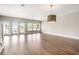 Open living room featuring hardwood floors, lots of natural light and ceiling fan at 135A Sunset Dr., Murrells Inlet, SC 29576